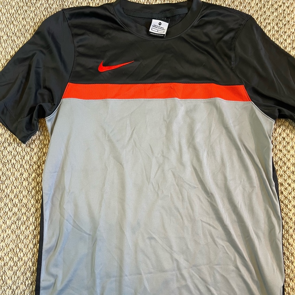 Nike dri-fit soccer shirt, black, grey and red with vents on backside. Sz. M